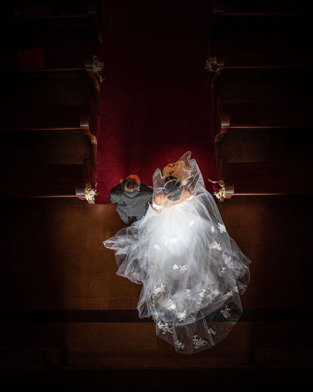 bride and groom walking down aisle viewed from above