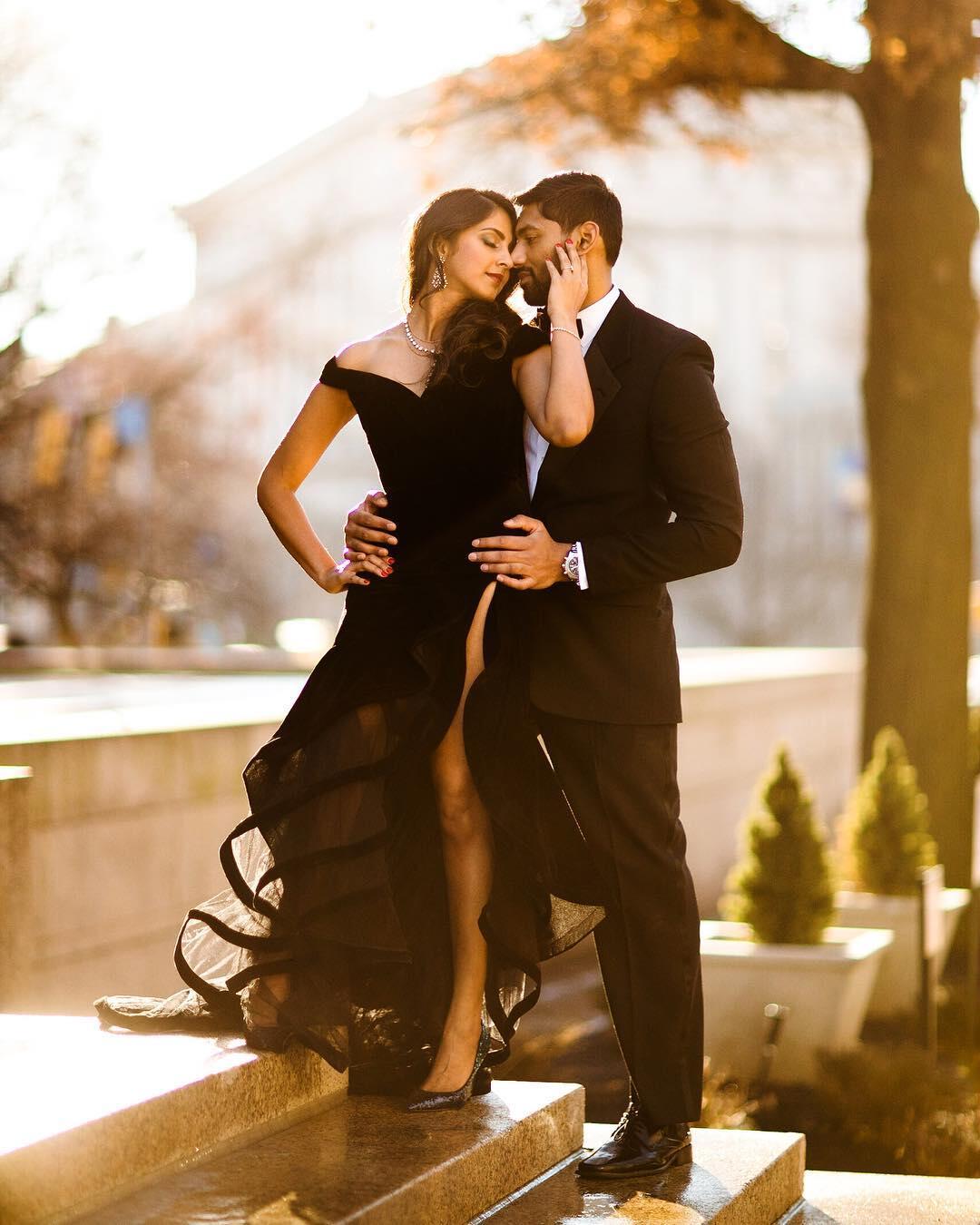 couple in black formal wear standing close
