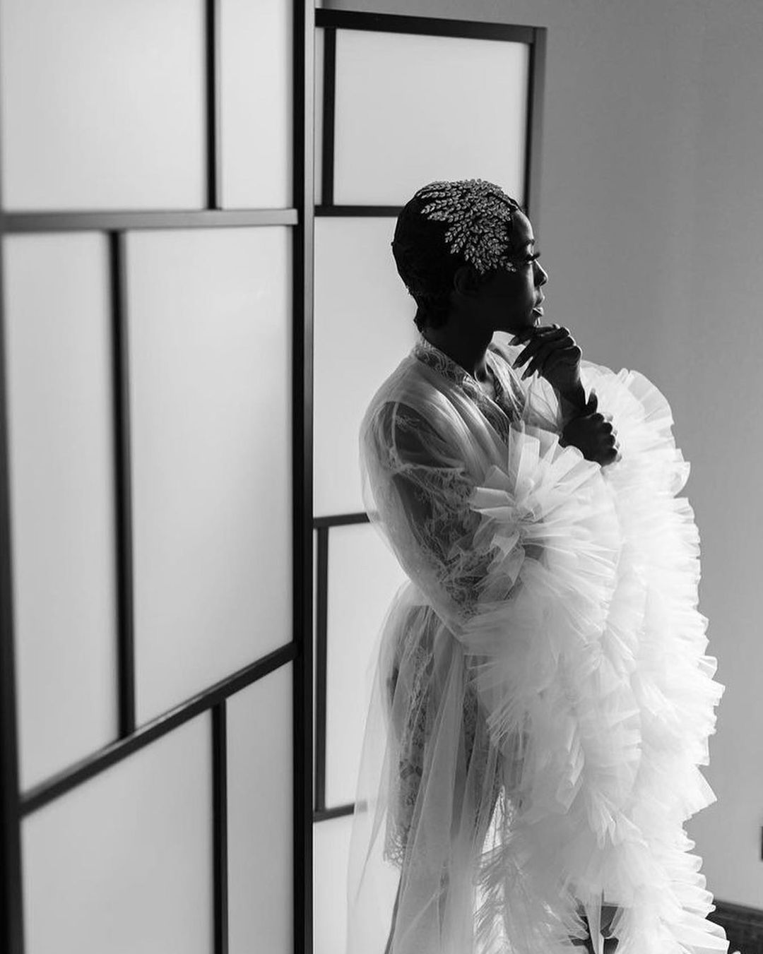 a black and white portrait of a bride in her beautiful wedding attire