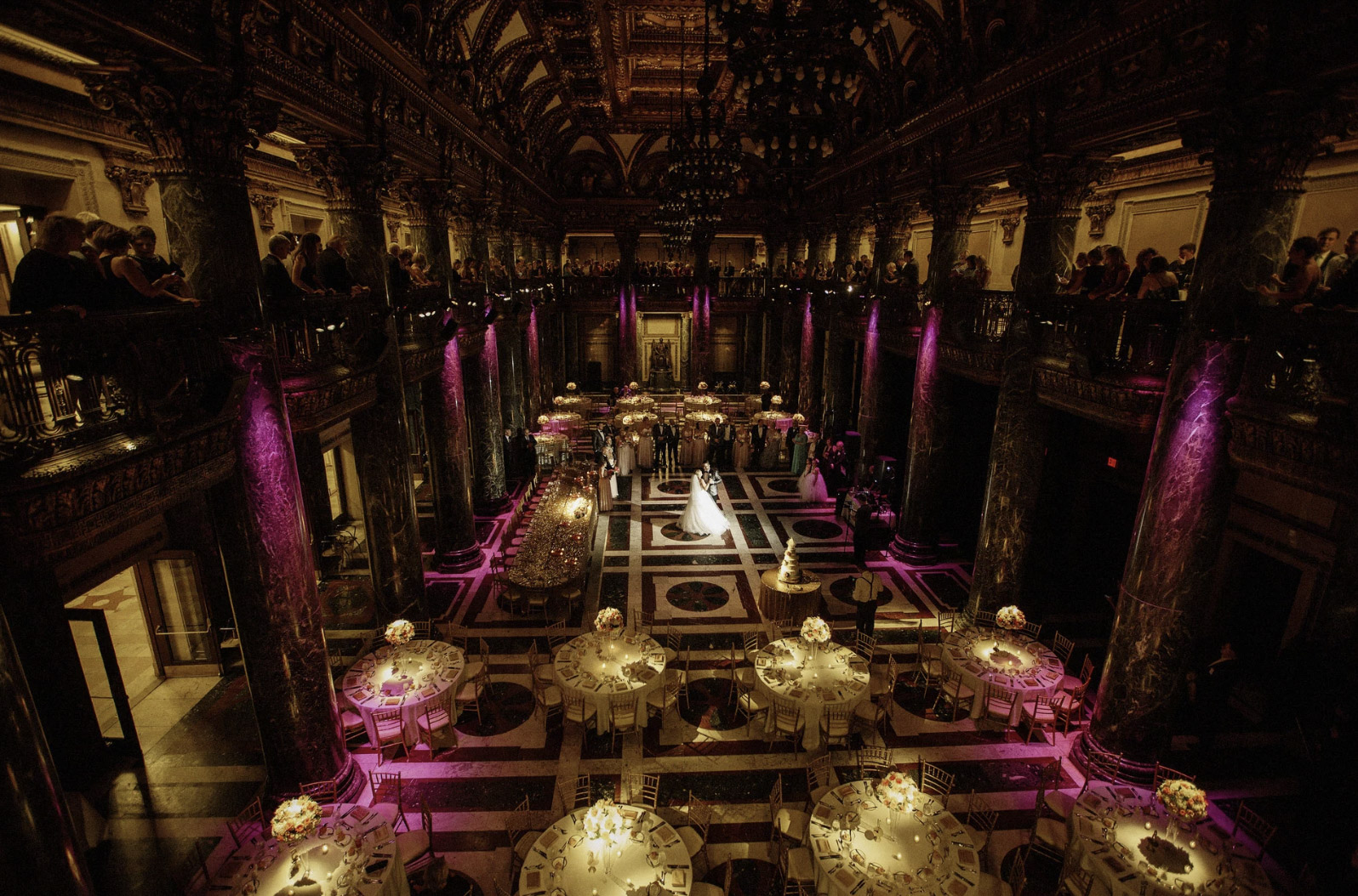 an image of a dimly lit wedding venue from the balcony